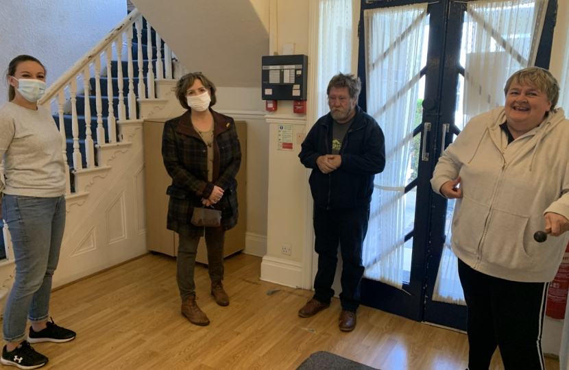 Photo: (left to right) Kelly Isaacs, Janet Finch-Saunders MS, Clive, and Caroline.