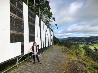Janet by the Llanrwst sign