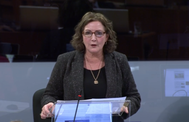 Janet addressing people.