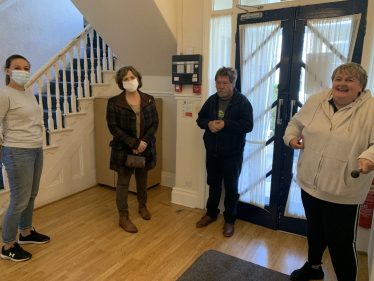 Photo: (left to right) Kelly Isaacs, Janet Finch-Saunders MS, Clive, and Caroline.